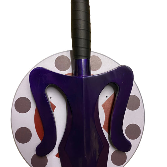 Purple sword with a polka plaque on a white background