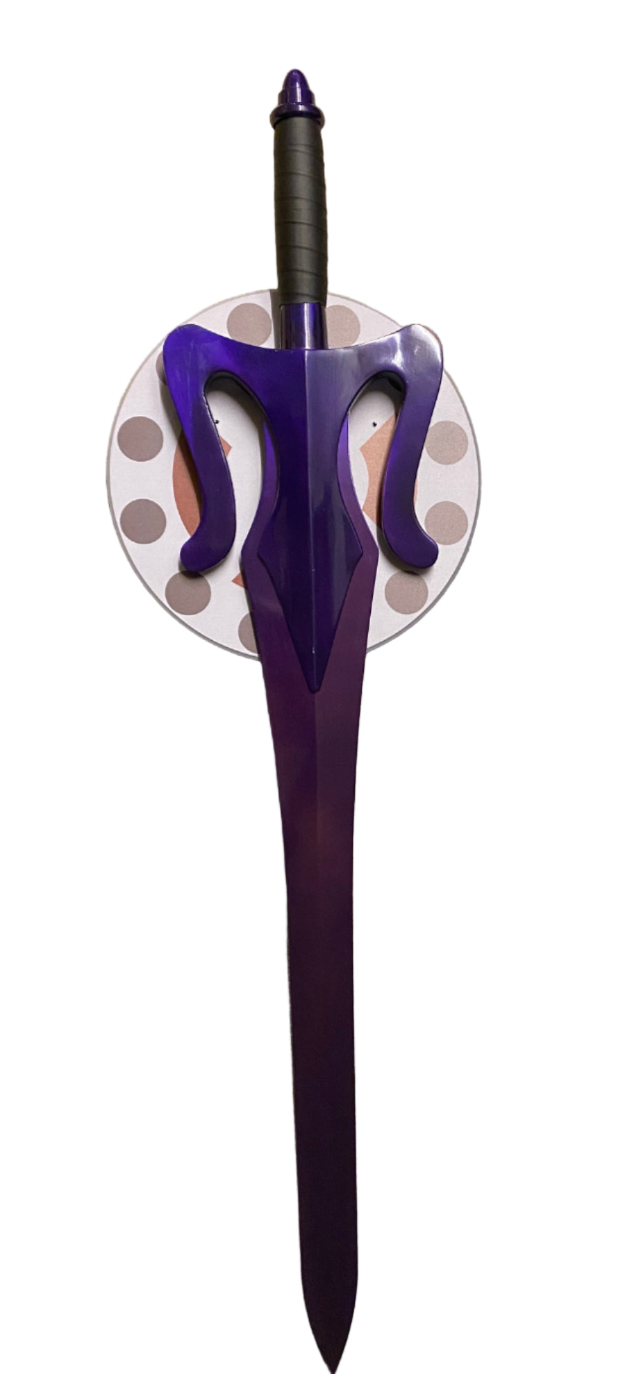 Purple sword with a circular plaque on a white background