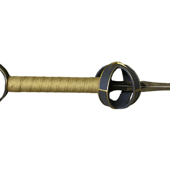 Decorative spear with black and gold design on a white background