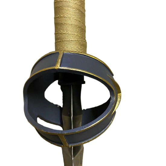 Sword hilt with gold wrapping on a white background