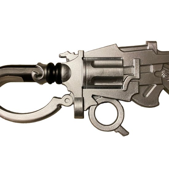 Close-up of a detailed silver weapon on a white background
