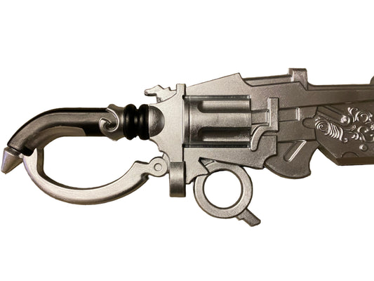 Close-up of a detailed silver weapon on a white background