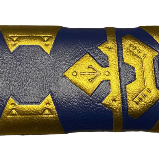 Close-up of a blue and gold handle with intricate designs
