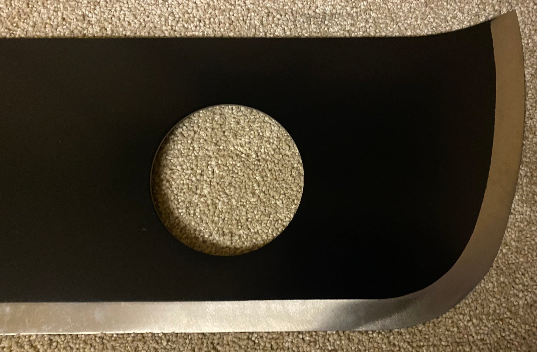 Black sword with a circular cut out