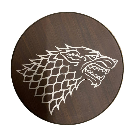 Wooden plaque with a wolf head design on a white background