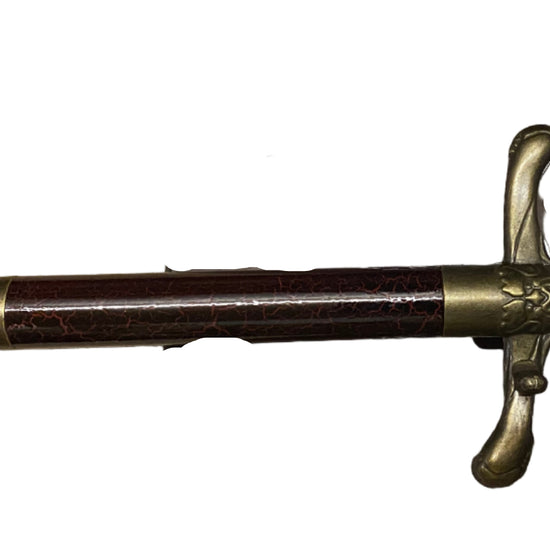 Decorative sword with ornate hilt on a white background