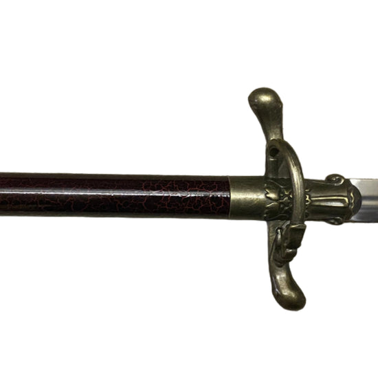Sword with decorative hilt on a white background