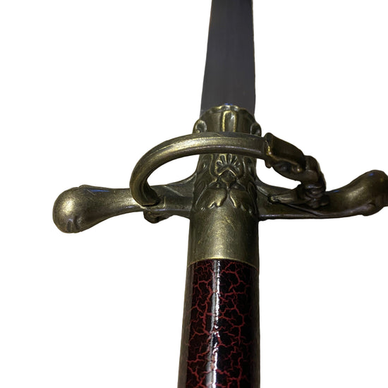 Sword with decorative hilt on a white background