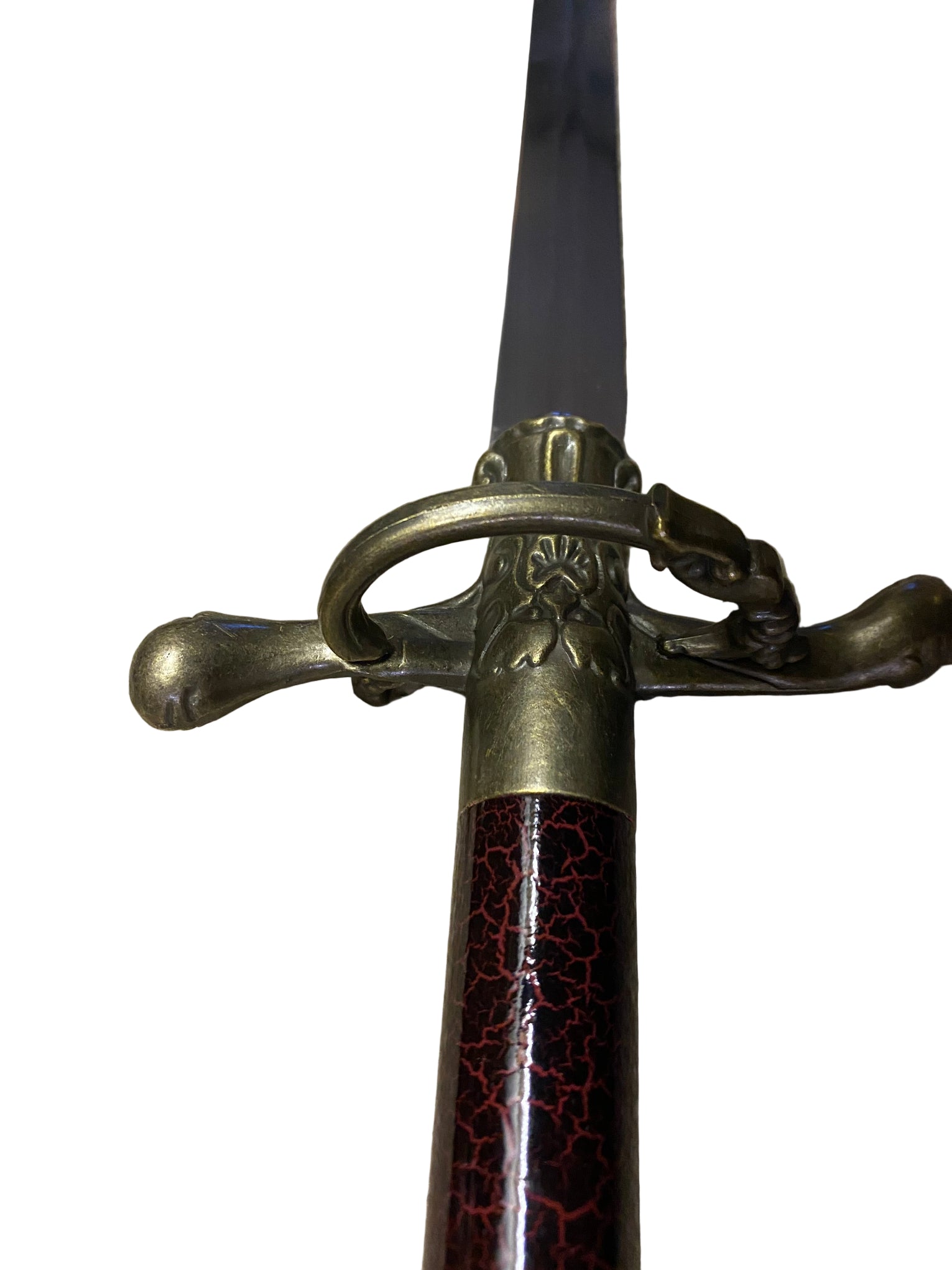 Sword with decorative hilt on a white background