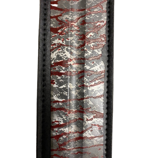 Decorative item with red and white pattern on a gray background