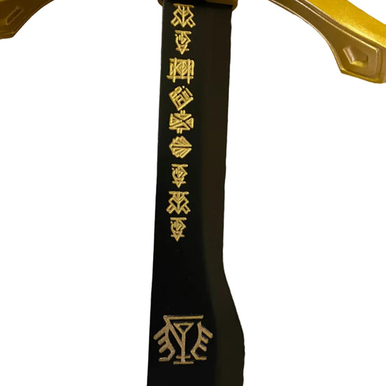 Close-up of a yellow sword with black shaft featuring branding on a white background