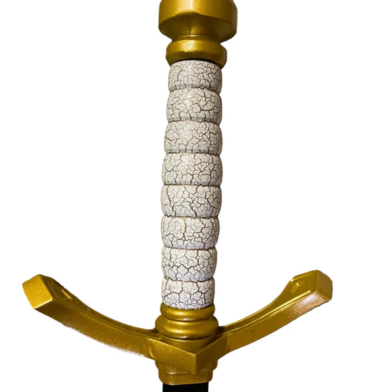 Sword with gold hilt and white stone handle on a white background