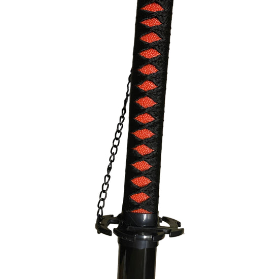 Black sword sheath with red patterns and chain on a white background