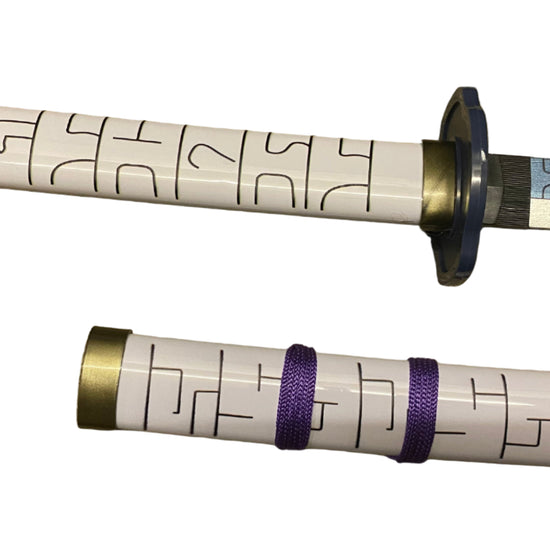 sword handles with decorative patterns on a white background