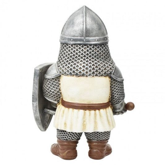 A medieval knight figurine shown from the back, wearing silver chainmail armor, a pointed silver helmet, a cream-colored tunic with a brown belt, and brown boots, holding a silver shield.