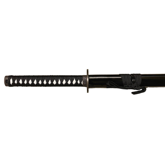 Black sword with decorative handle on a white background