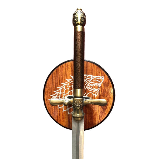 Decorative sword with wooden sheath featuring a dragon emblem on a white background