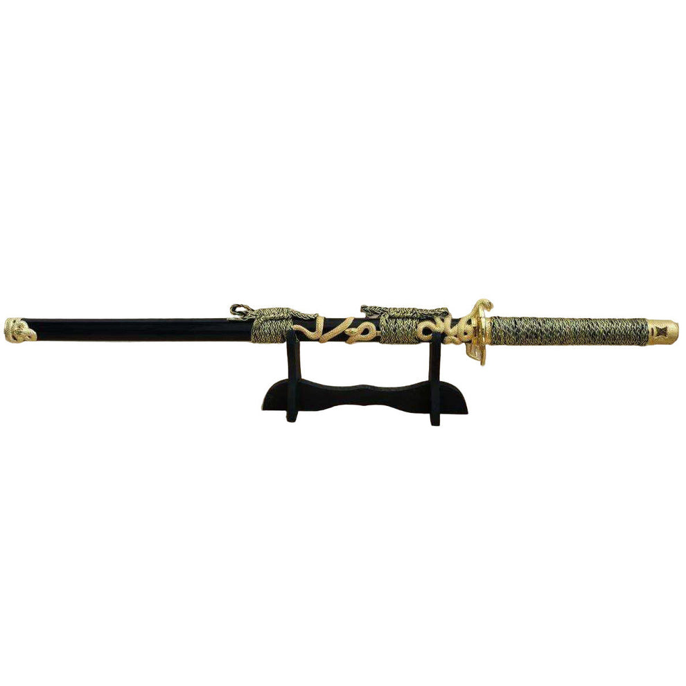 Sword with gold and black design on a white background