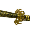 Gold bracelet with intricate design on a beige background