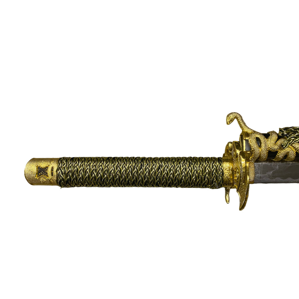 Decorative sword with gold handle and blade on a white background