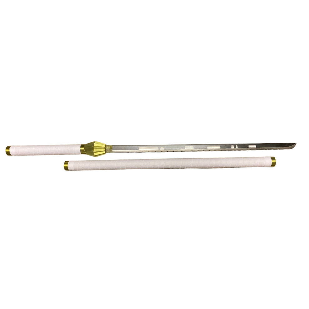 sword handle with gold accents on a white surface