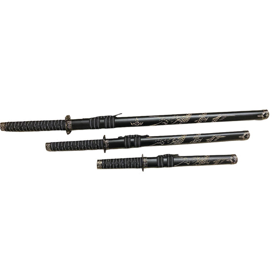 Set of black martial arts weapons with decorative patterns on a white background