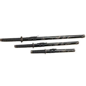 Set of black martial arts weapons with decorative patterns on a white background