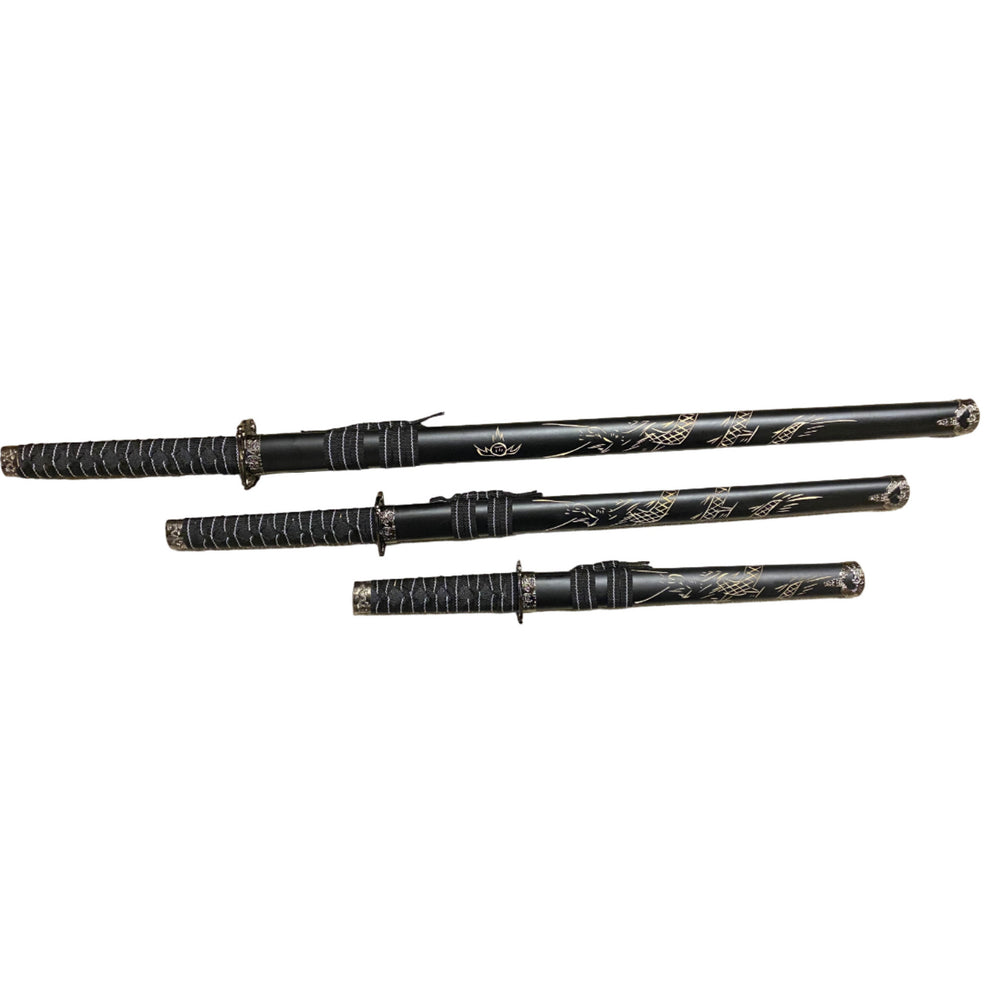 Set of black martial arts weapons with decorative patterns on a white background