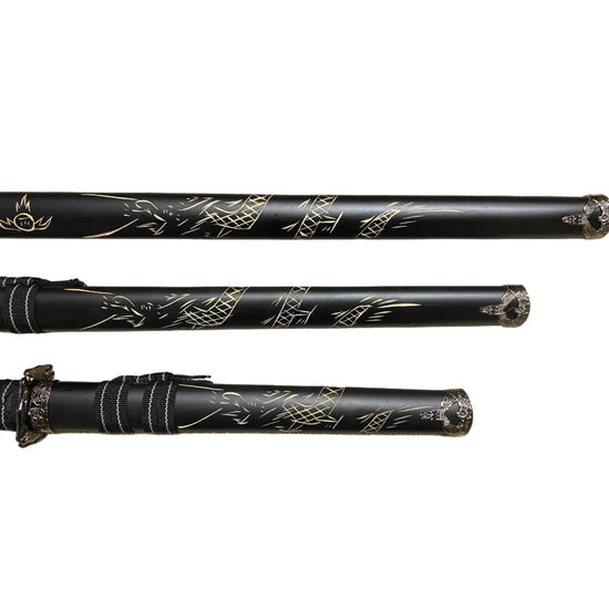 Three black swords with engraving on a white background
