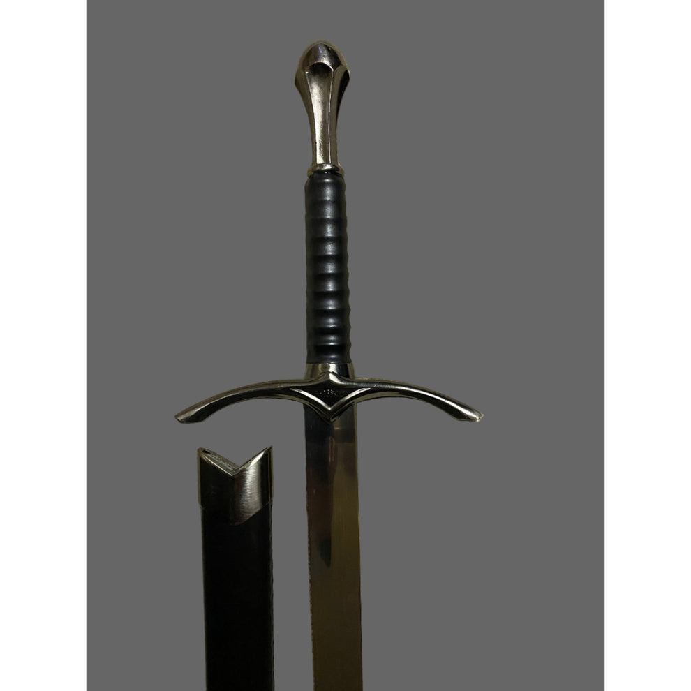 Sword with a black handle and silver blade on a gray background