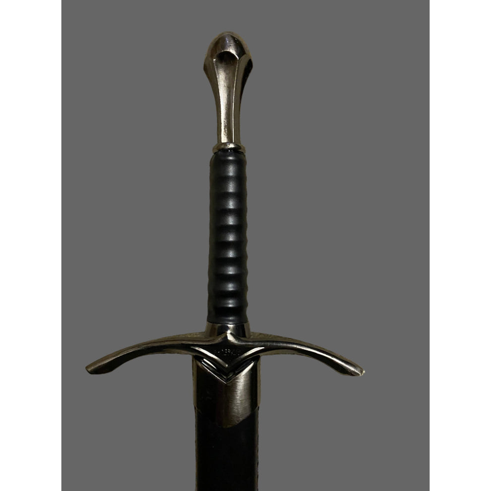 Sword with a black handle and silver blade on a gray background