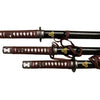Three samurai swords with brown sheaths on a white background