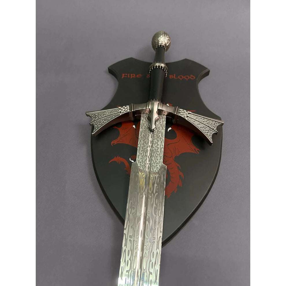 A replica of Visenya's Daemon Targaryen sword from Game of Thrones, featuring a black and red shield with the Targaryen House Sigil, a silver blade, and a decorative handle.