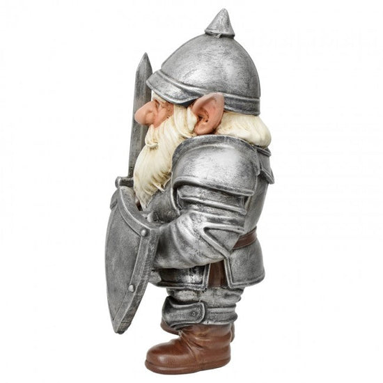 A fantasy knight garden gnome figurine wearing silver armor, a pointed helmet, a long white beard, and brown boots, holding a shield and sword, shown against a plain white background.