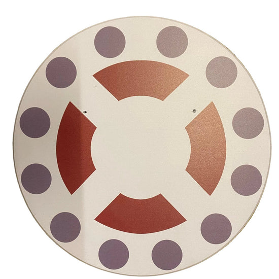 Decorative plate with purple polka dots and red geometric shapes on a beige background