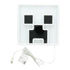 White electronic device with black components and a USB cable on a white background