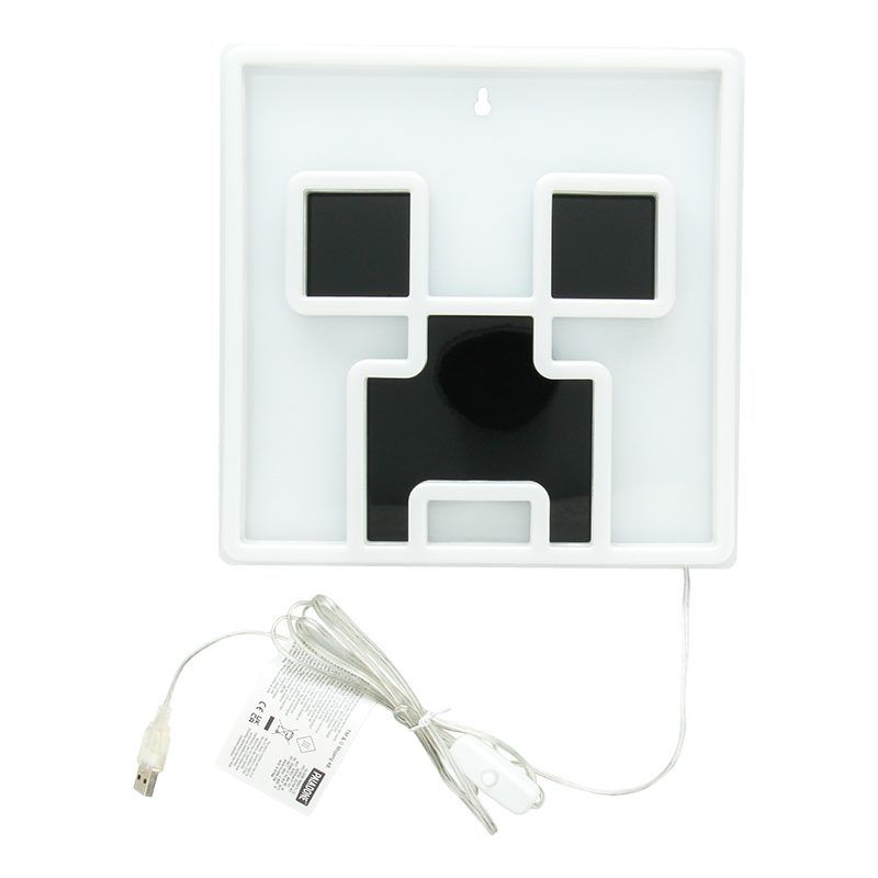 White electronic device with black components and a USB cable on a white background