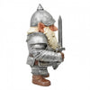 A small gnome figurine dressed as an armored knight, holding a sword, shown against a plain white background. The figurine has silver-gray armor and helmet, a cream-colored beard, brown boots, and pointed ears.