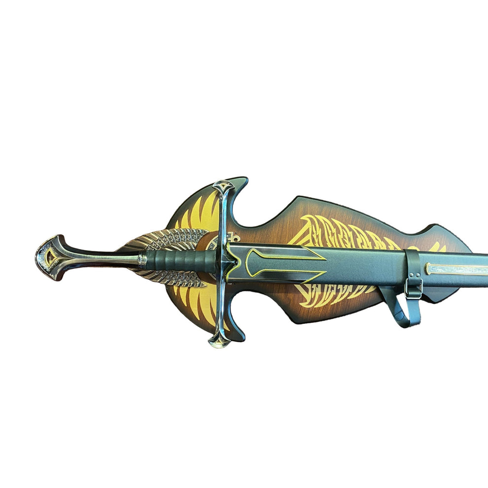Decorative sword with gold and black design on a brown textured background