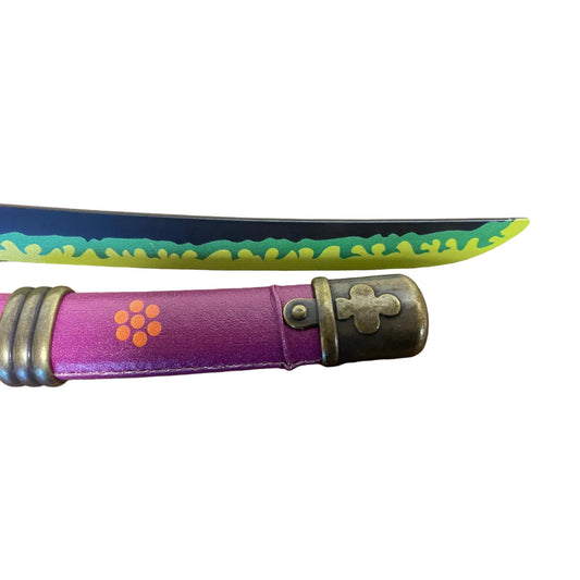 Purple folding knife with floral design on a brown surface