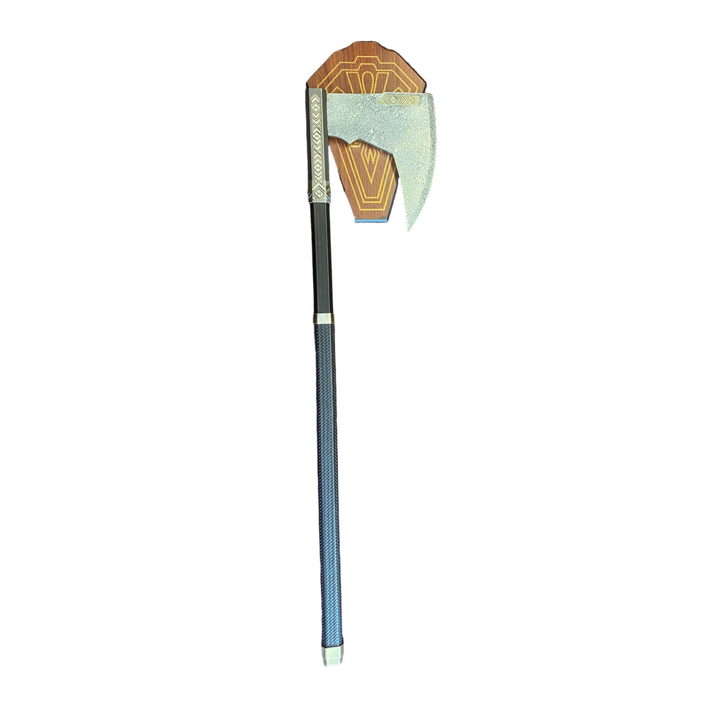 Decorative axe with a geometric head on a textured surface