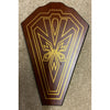 Decorative wooden panel with gold intricate design on a textured surface