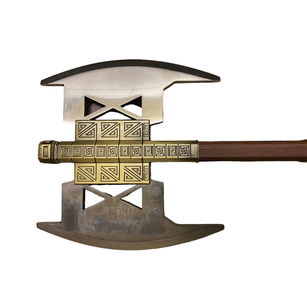 Decorative axe with gold and silver design on a white background