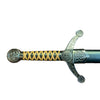 Decorative sword handle with intricate designs on a textured surface
