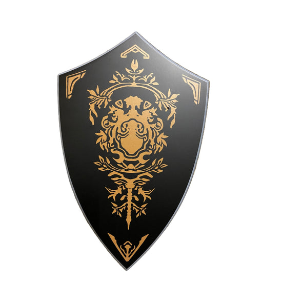 Decorative shield with gold emblem on a black background
