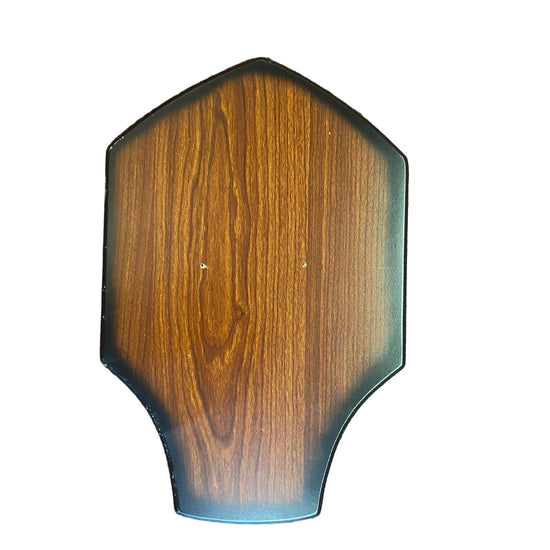 Wooden plaque with a blue border on a textured brown surface