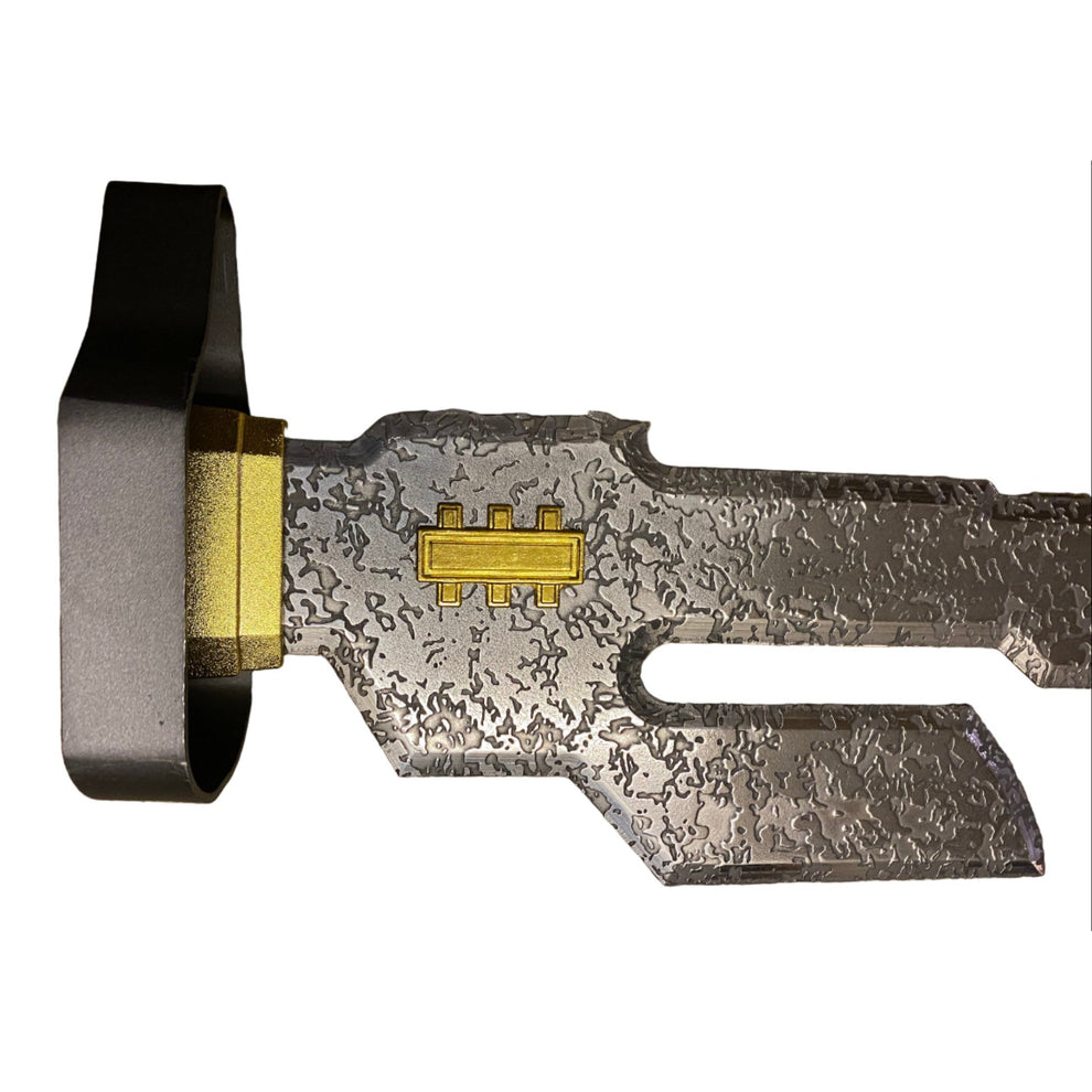 Close-up of a metallic object with intricate design on a white background