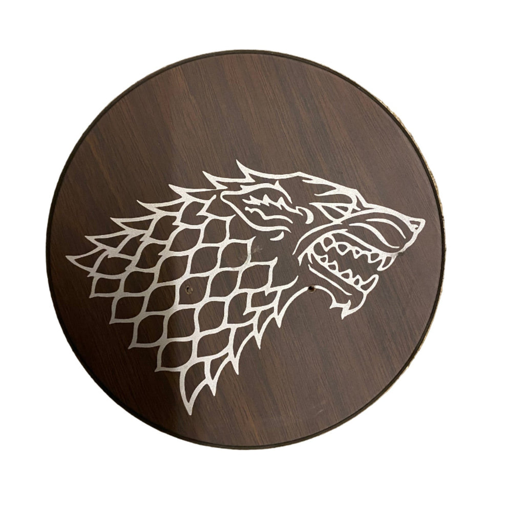 Wooden plaque with a wolf head design on a white background