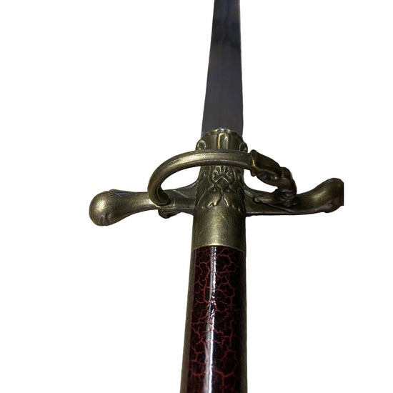 Sword with decorative hilt on a white background