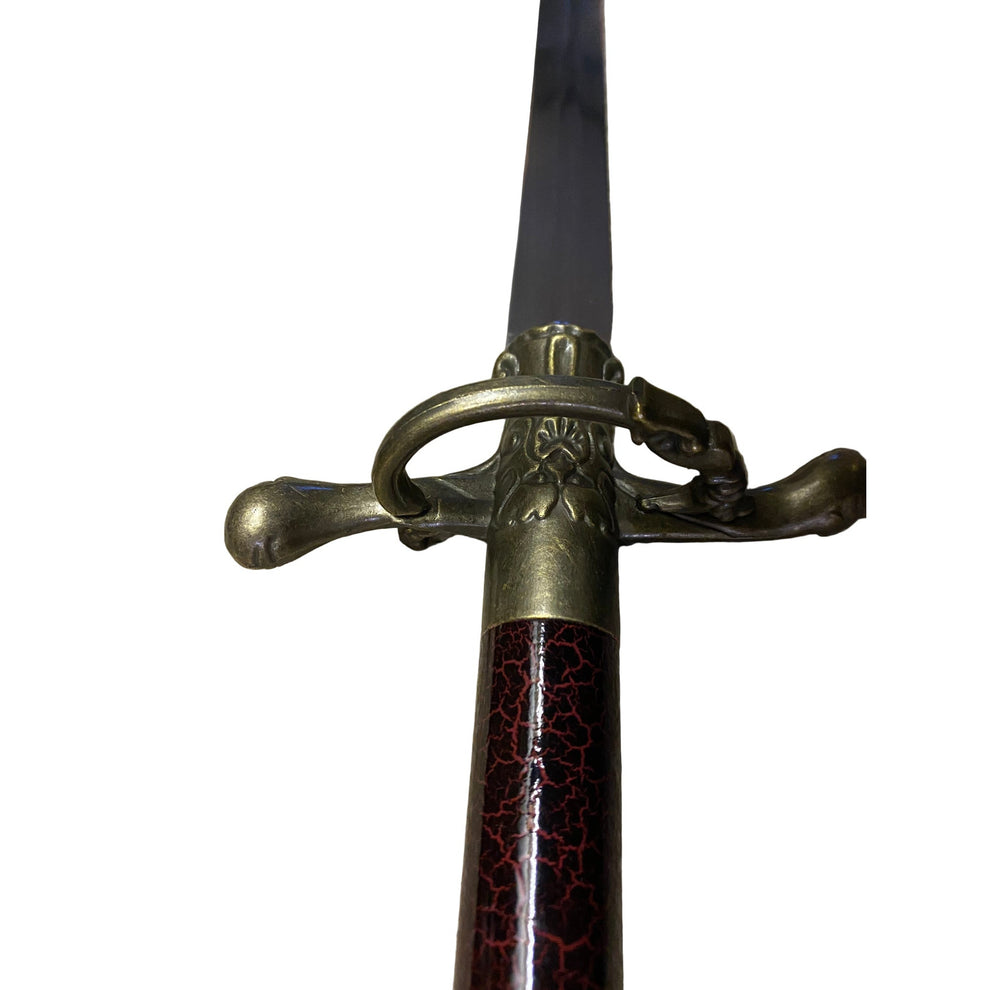 Sword with decorative hilt on a white background